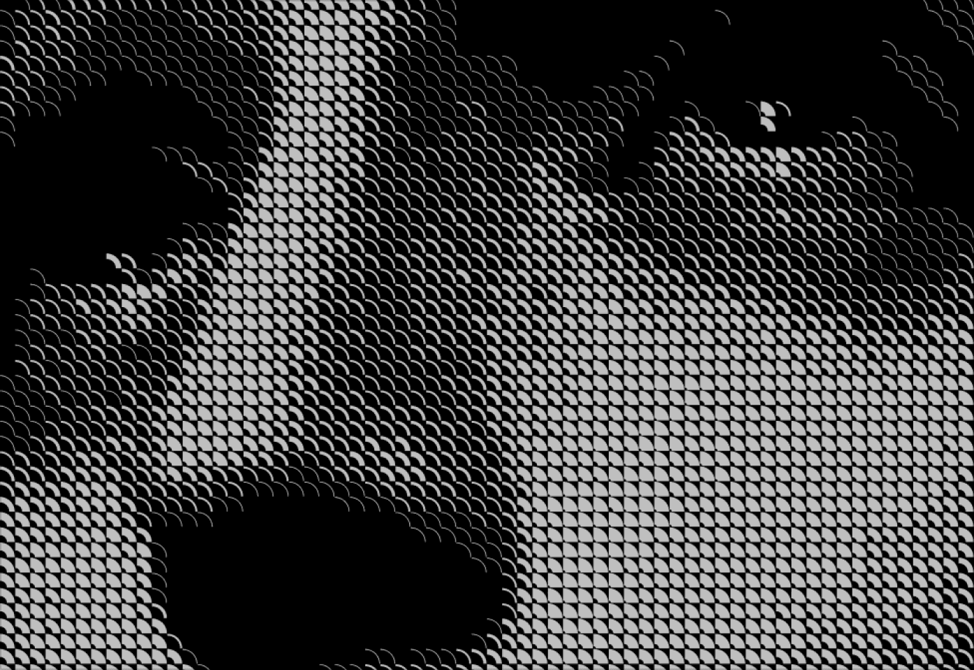 A close up of a person's face that has Reaktor textured shapes overalyed on top.